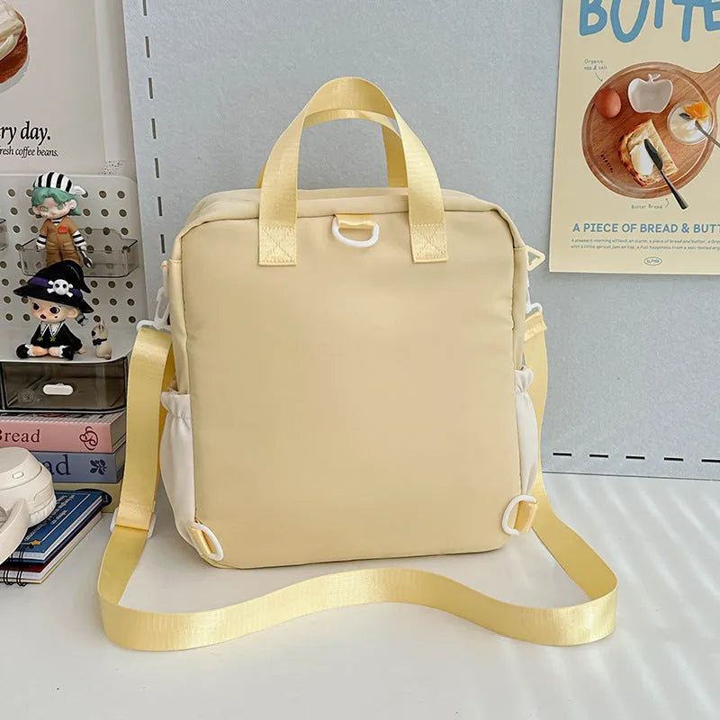 Waterproof nylon backpack in solid colour with sewing thread detail, 33x30x14cm, holds 15.6-inch laptop