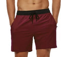 Men's blue drawstring fitness shorts with a zippered side pocket and stitching detail on the waistband.