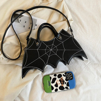 A stylish PU leather shoulder bag with a unique spider web and Batgirl-inspired design, available in a variety of vibrant colors.