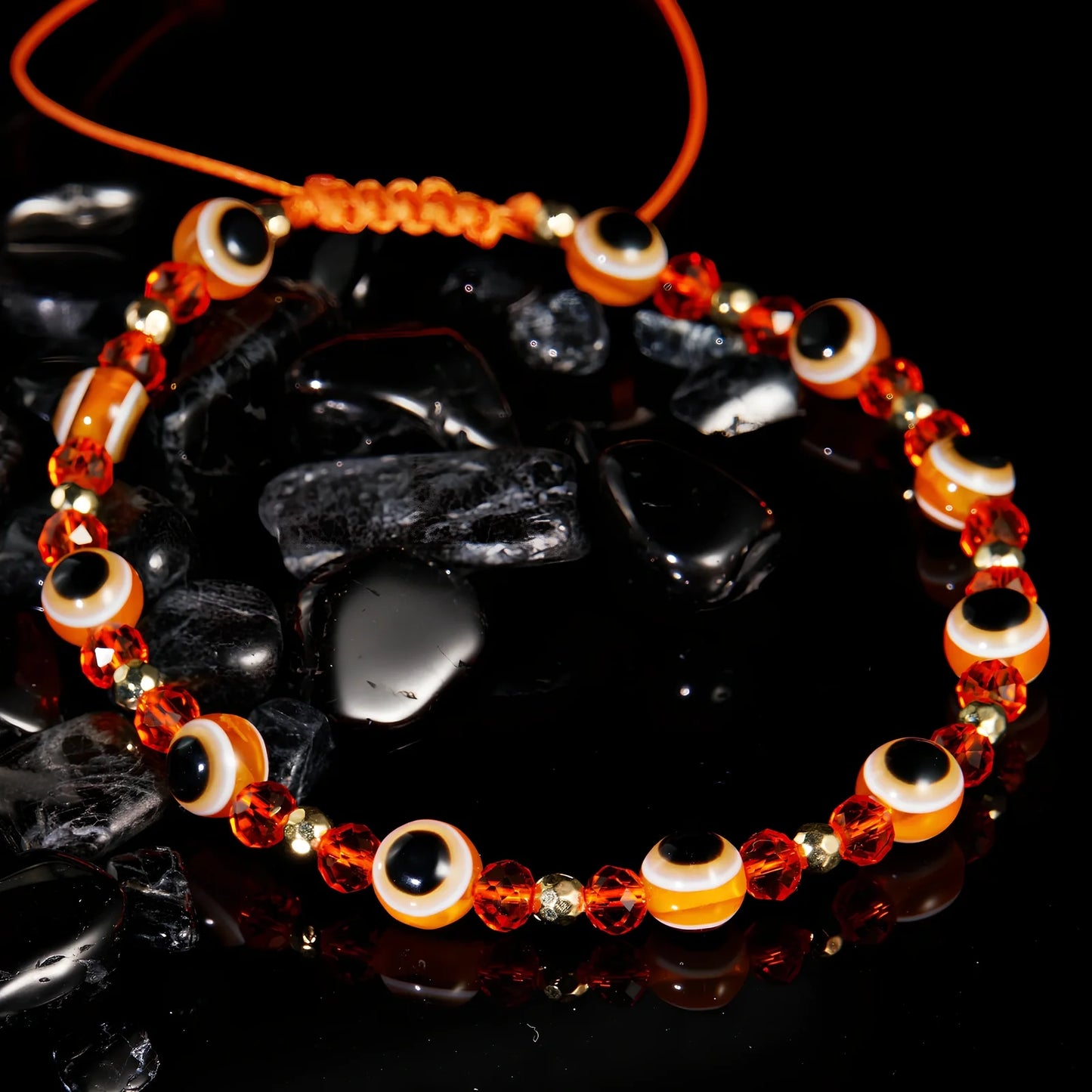 Adjustable crystal bead bracelet with blue eye design on braided rope, fits 15-19cm wrists