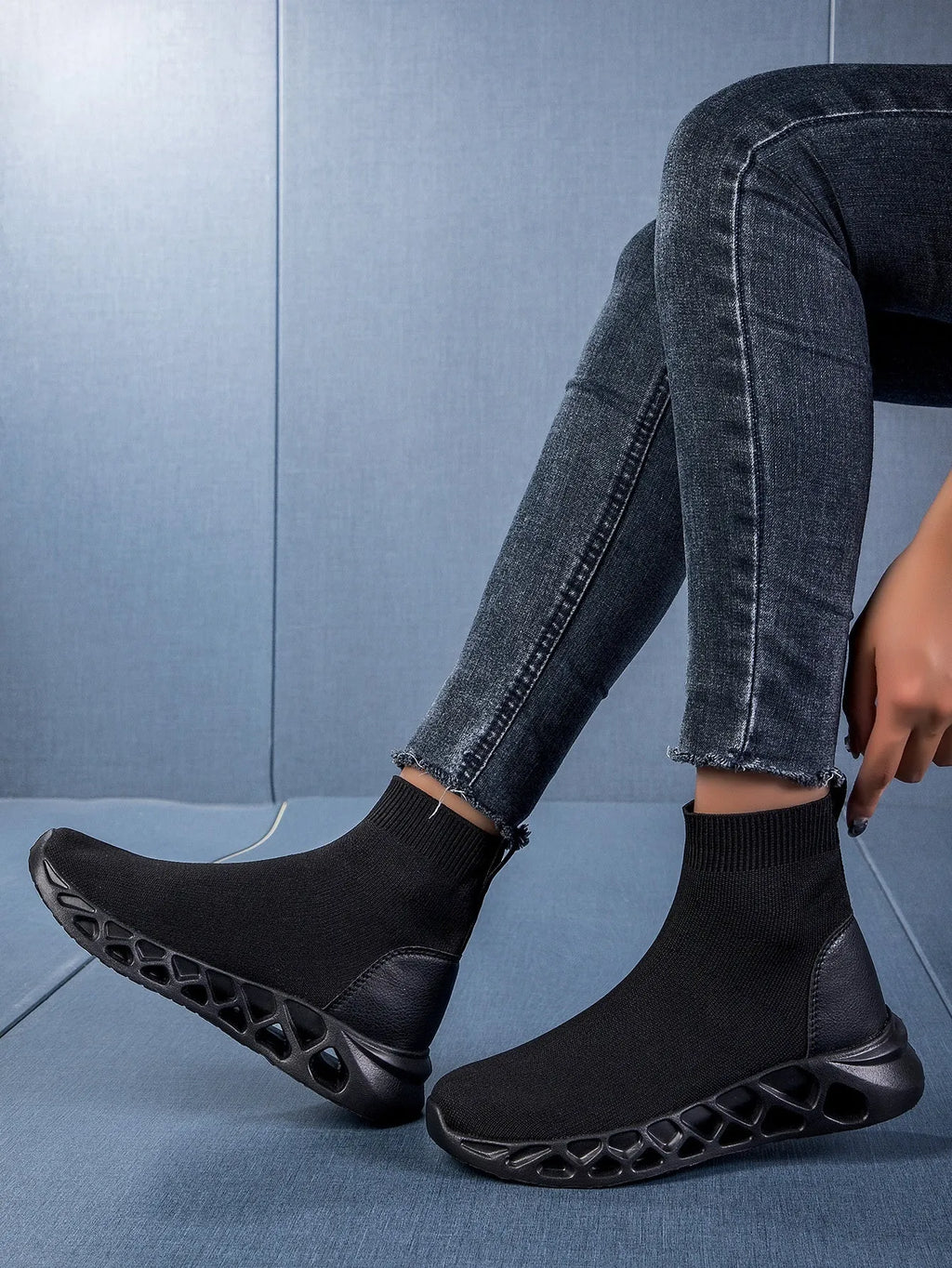 Women's terracotta coloured stretch mesh socks boots with flat heel and round toe on a white background.