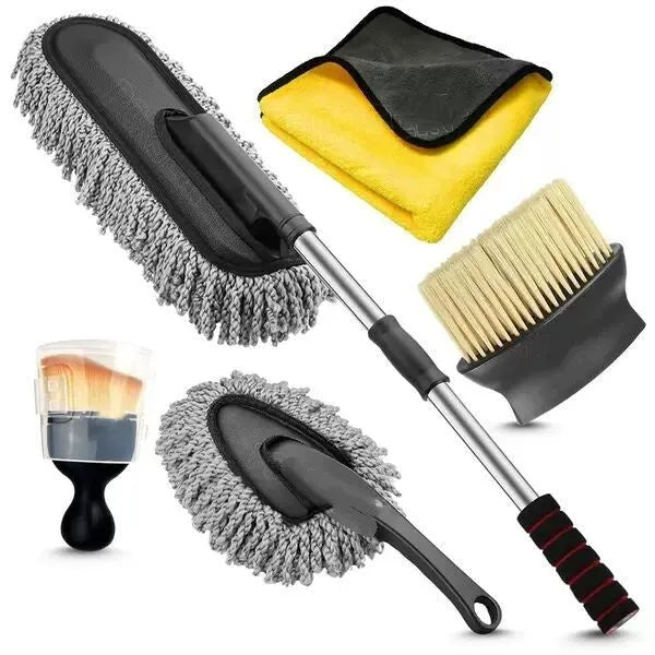 Car dust collector with retractable handle and five fibre brush heads on a car dashboard