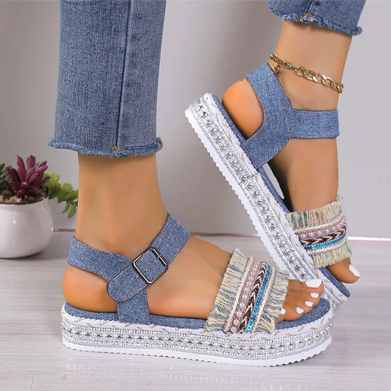 Women's tassel denim sandals with thick flat sole and buckle closure in blue