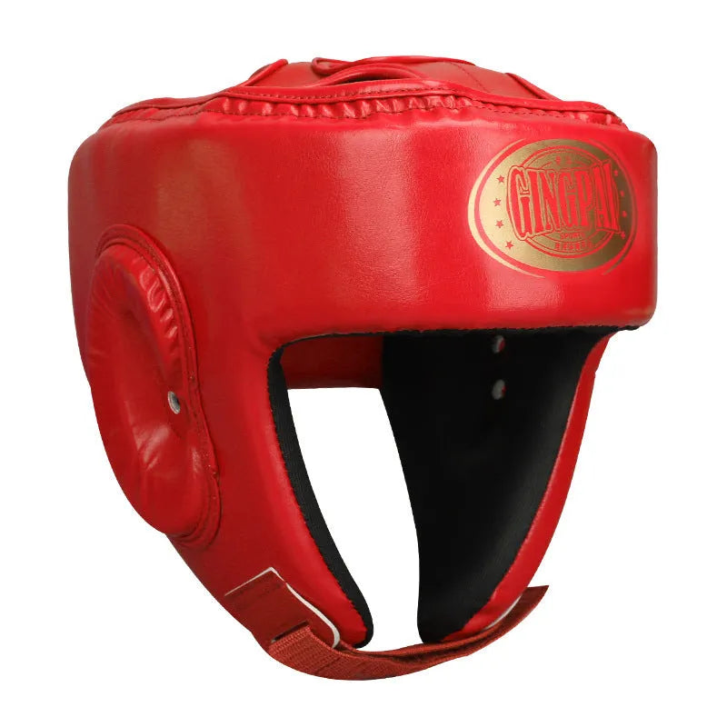 Fully enclosed red boxing helmet with jaw protection on a grey background.