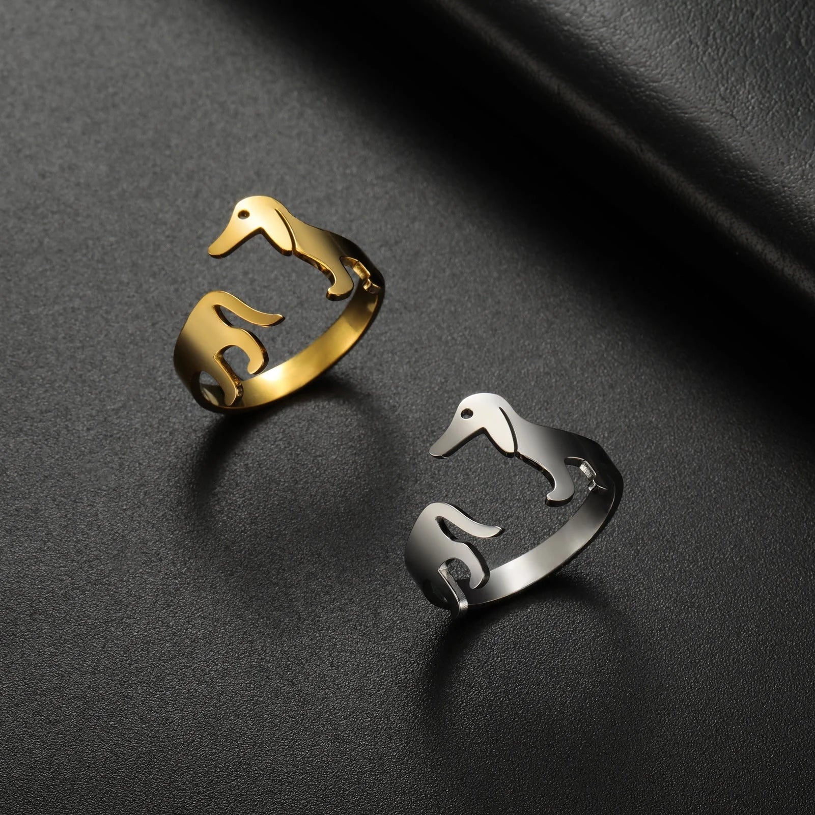 Adjustable titanium steel sausage dog ring in steel and gold finishes