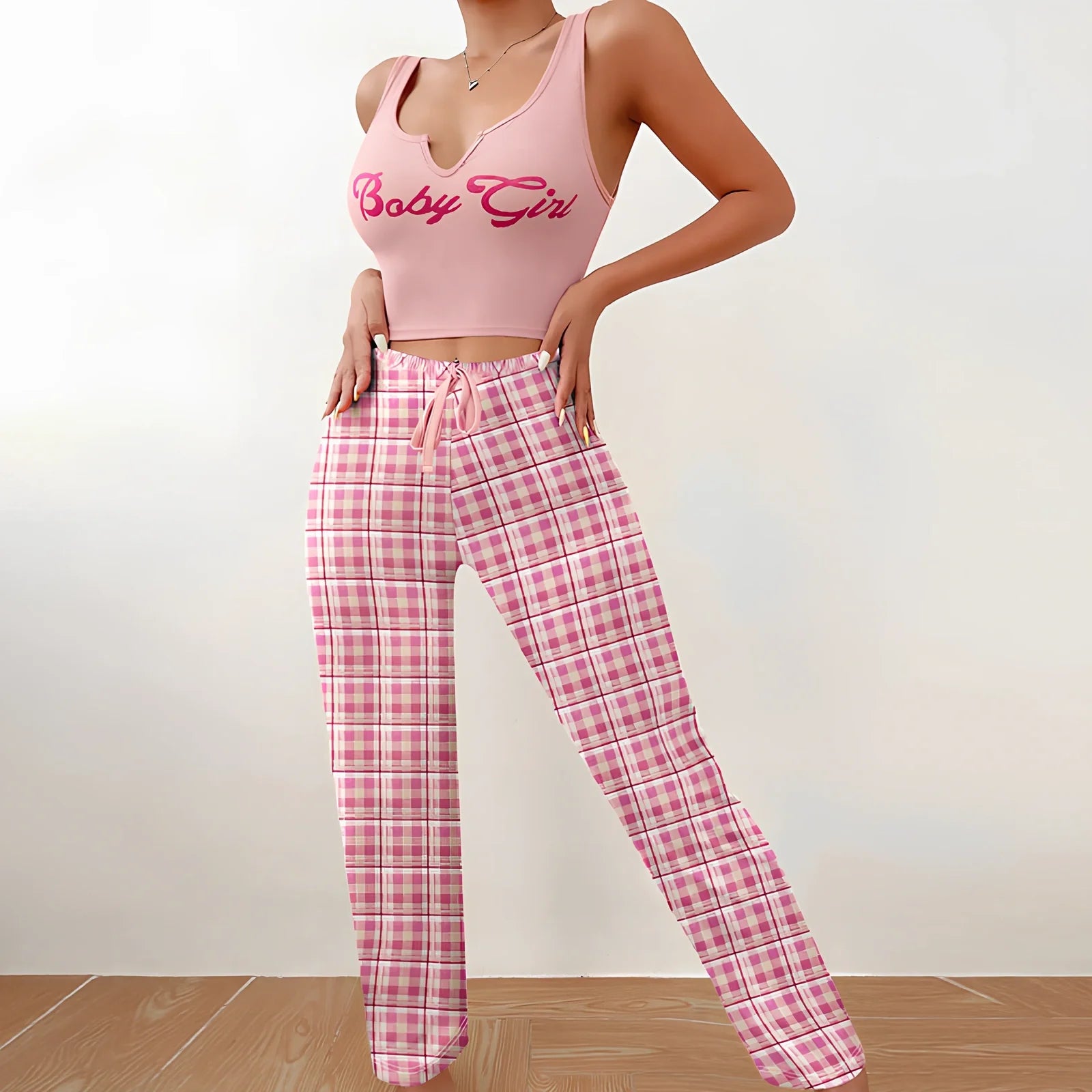 Women's plaid pyjama set with sleeveless letter print top and coordinating trousers for versatile homewear