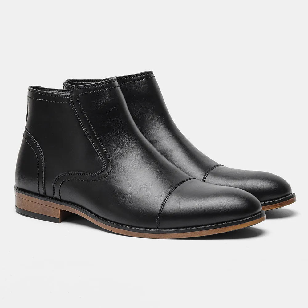 Men's brown Chelsea ankle boots with a side zip, shown on a foot.