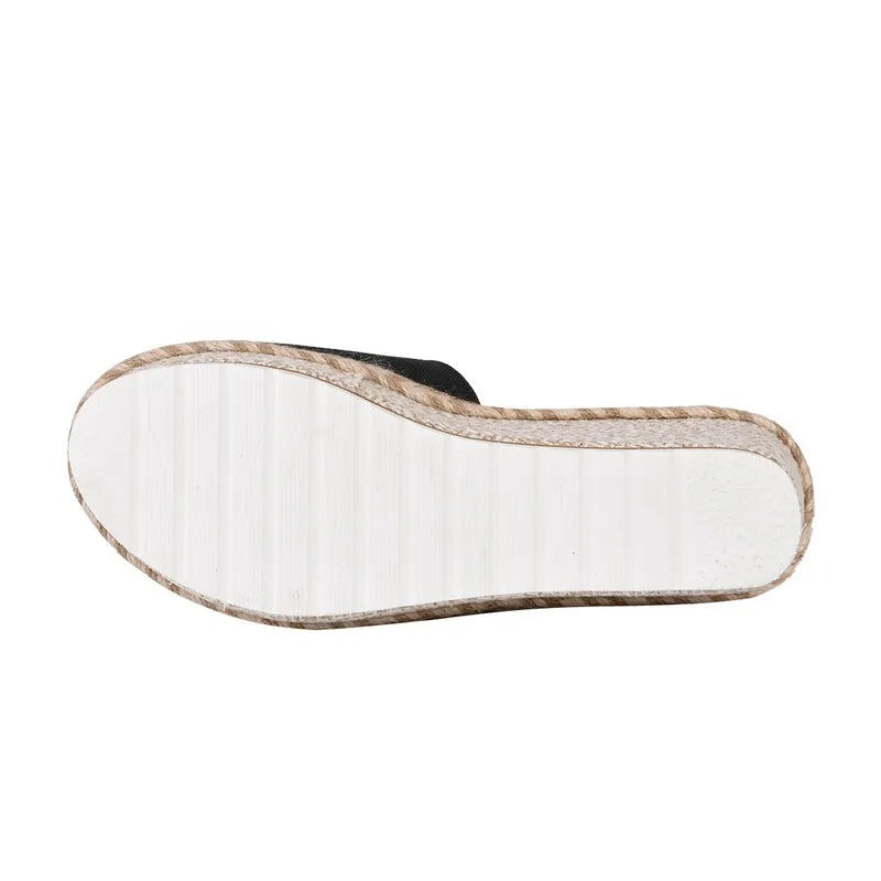 Platform wedge heel sandals with cloth upper in black, side view showing plain pattern and metal element detail