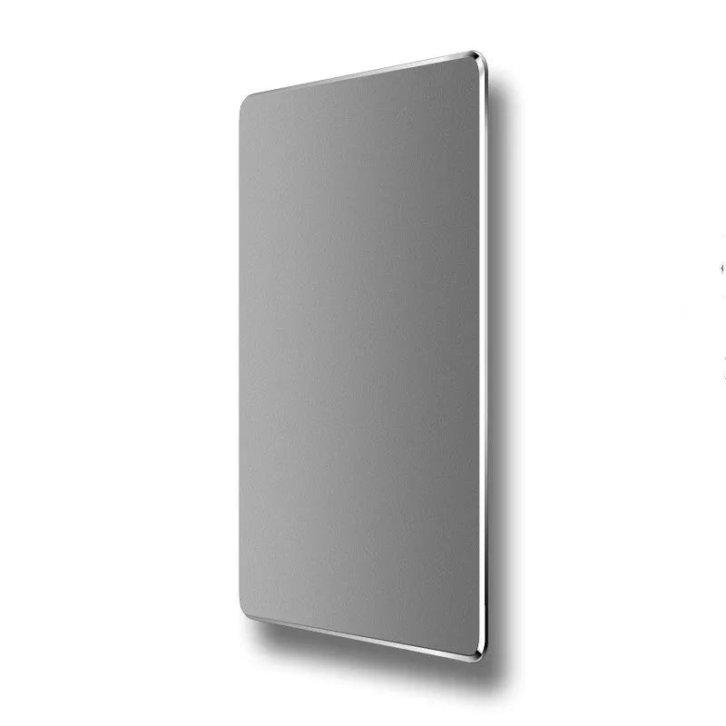 Double-sided aluminium mouse pad in black with non-slip base on a desk