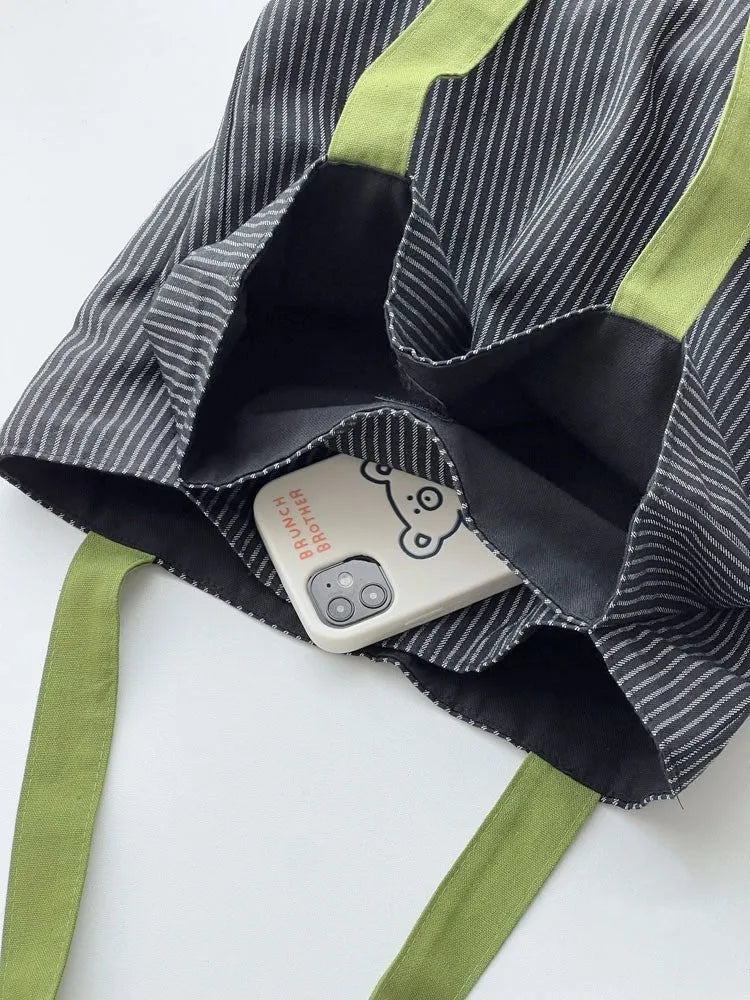 Canvas multi-layer tote shoulder bag showing three colour options: light pink stripes, black and gray plaid, dark gray stripes