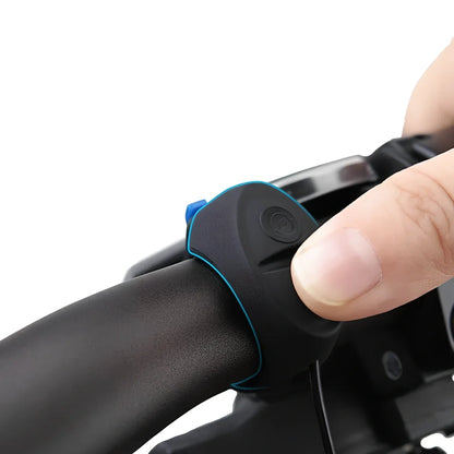 Compact black TWOOC T-002 bicycle electronic horn with wired switch, 110-120dB sound modes, mounted on handlebar via rubber strap
