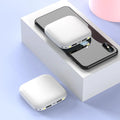 Portable 10000mAh power bank with multi-USB ports in black, white, blue, and pink colours