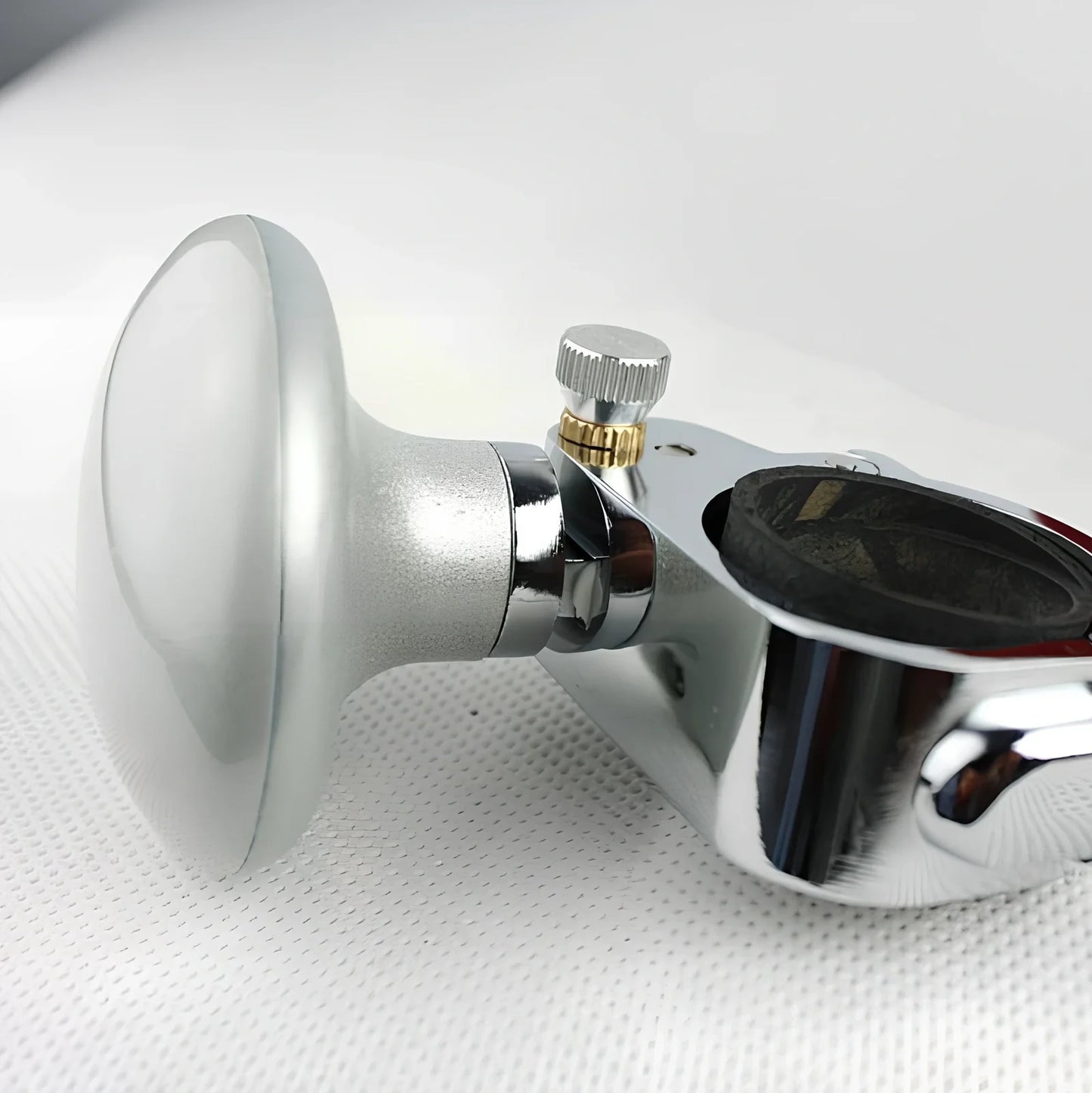 Adjustable stainless steel steering wheel booster in black, fitting up to 32mm thick rims for cars