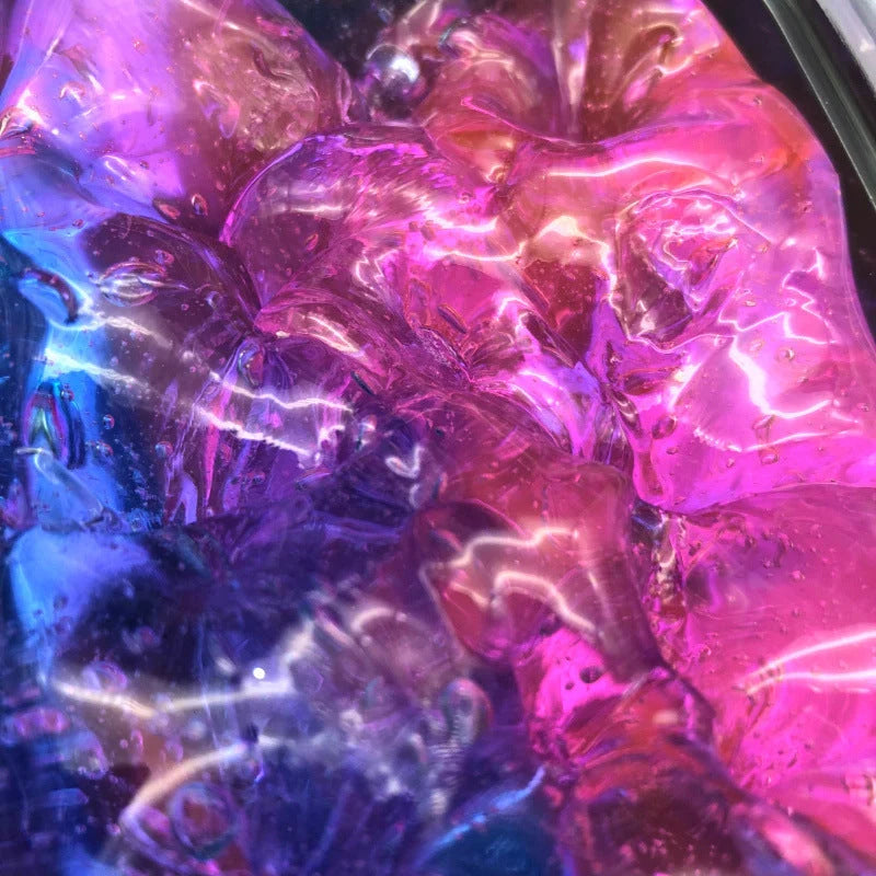 Gradient multicolor crystal mud slime in a plastic box, showcasing its vibrant colors and smooth texture