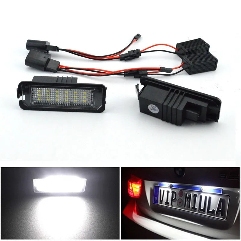 Two Volkswagen LED license plate light bulbs with white LEDs and electrical connectors.