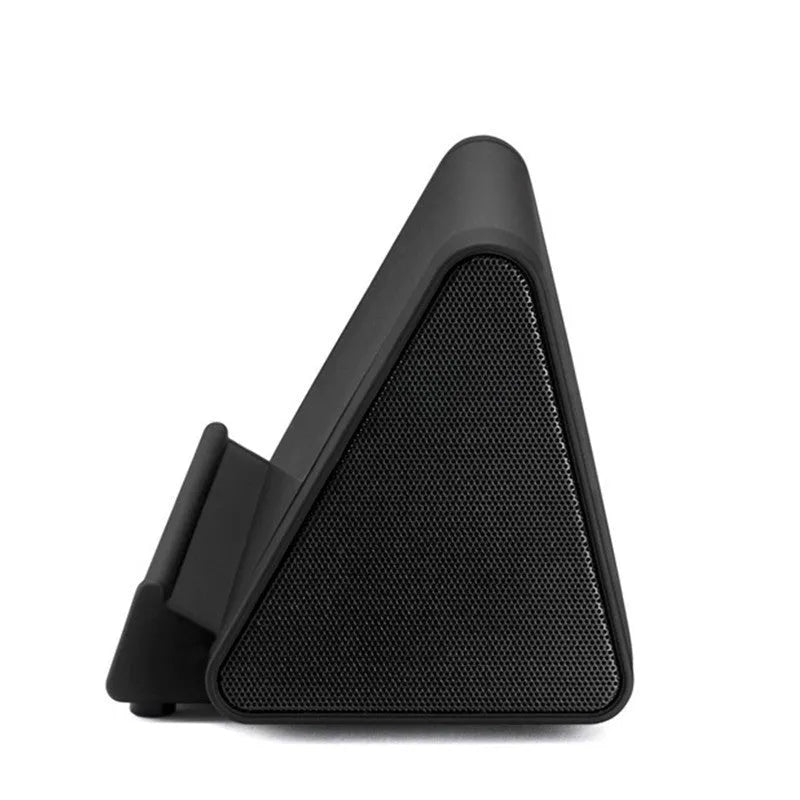 A small black or white wireless Bluetooth speaker for mobile phones and computers