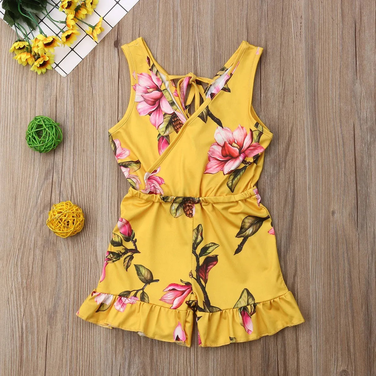 Baby girl wearing cotton floral summer outfit in white or yellow colour