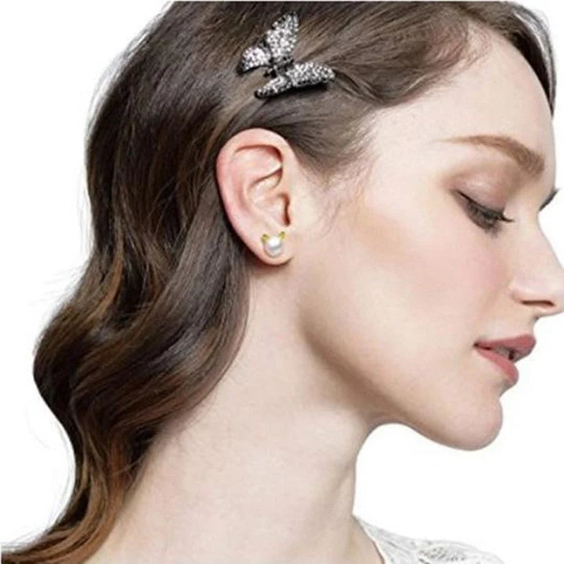 Cat-themed earrings in silver and gold, lightweight and stylish