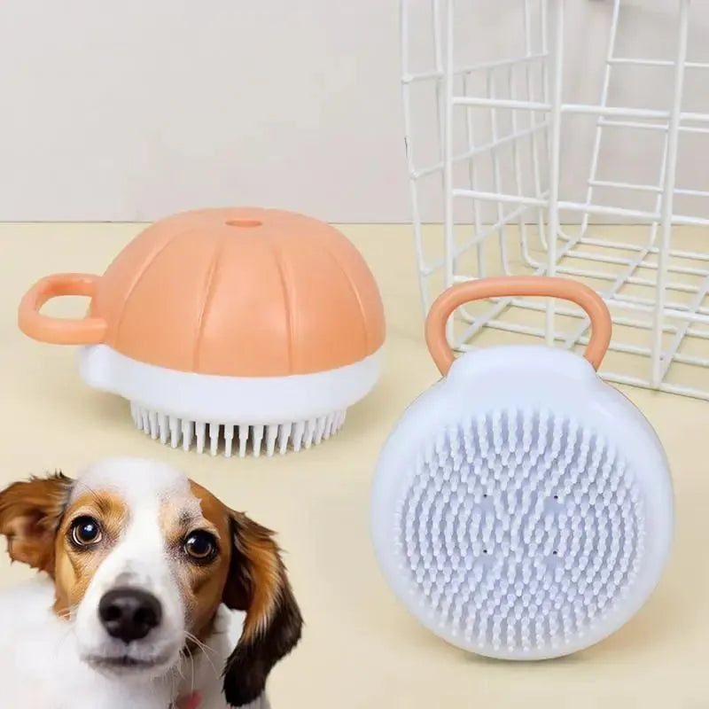 Orange dog bath brush with shampoo dispenser and soft TPR bristles for pet grooming
