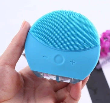 Blue ceramic plant pot with integrated water reservoir and drainage holes for indoor plants