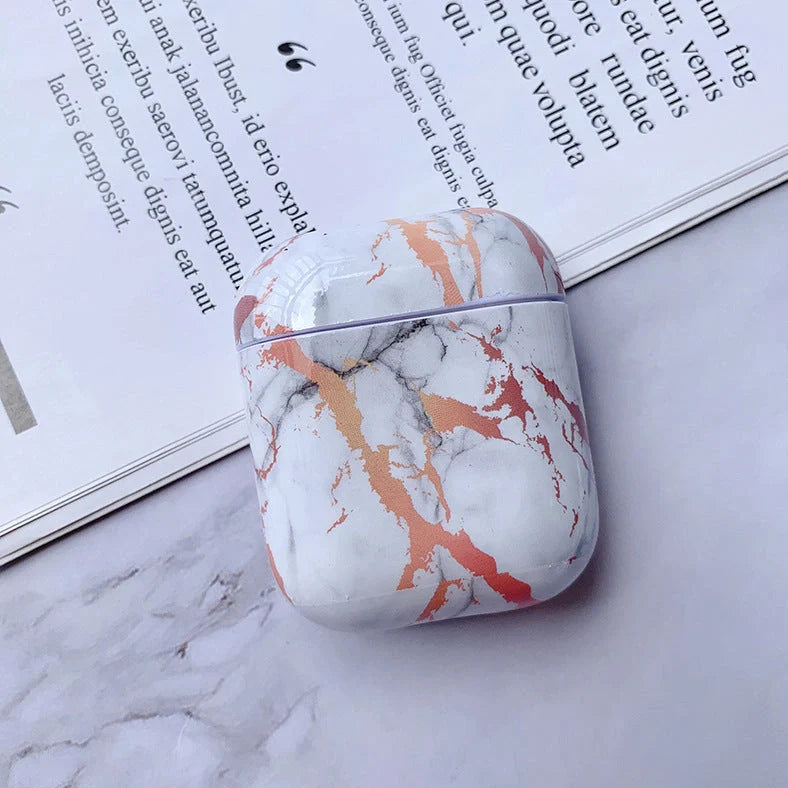 White marble pattern AirPods protective case with hard PC construction showing charging port access