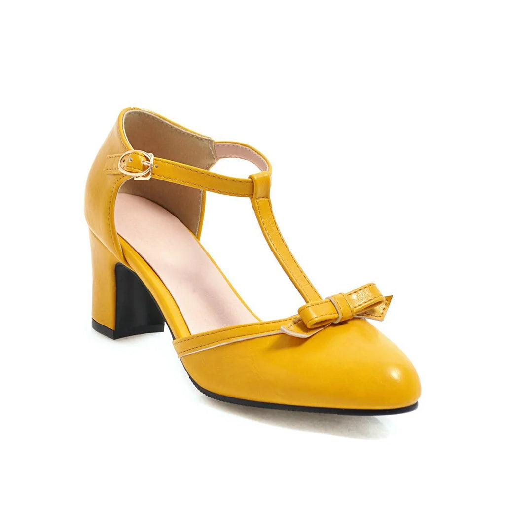 Women's apricot coloured chunky heel sandals with a bow detail and buckle strap on a 6.5cm heel.