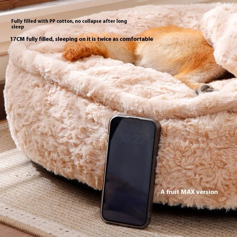 Milk tea colour round pet bed with a removable cloth cover on a wooden floor.