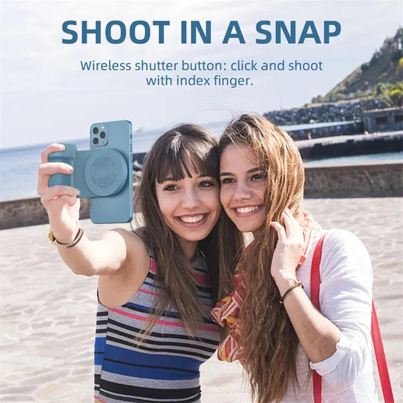 Black magnetic 3-in-1 phone camera grip and stand with ergonomic handle on a table