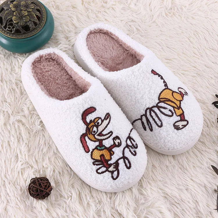 White cartoon pattern fluffy slippers with a plush upper and a non-slip rubber sole.