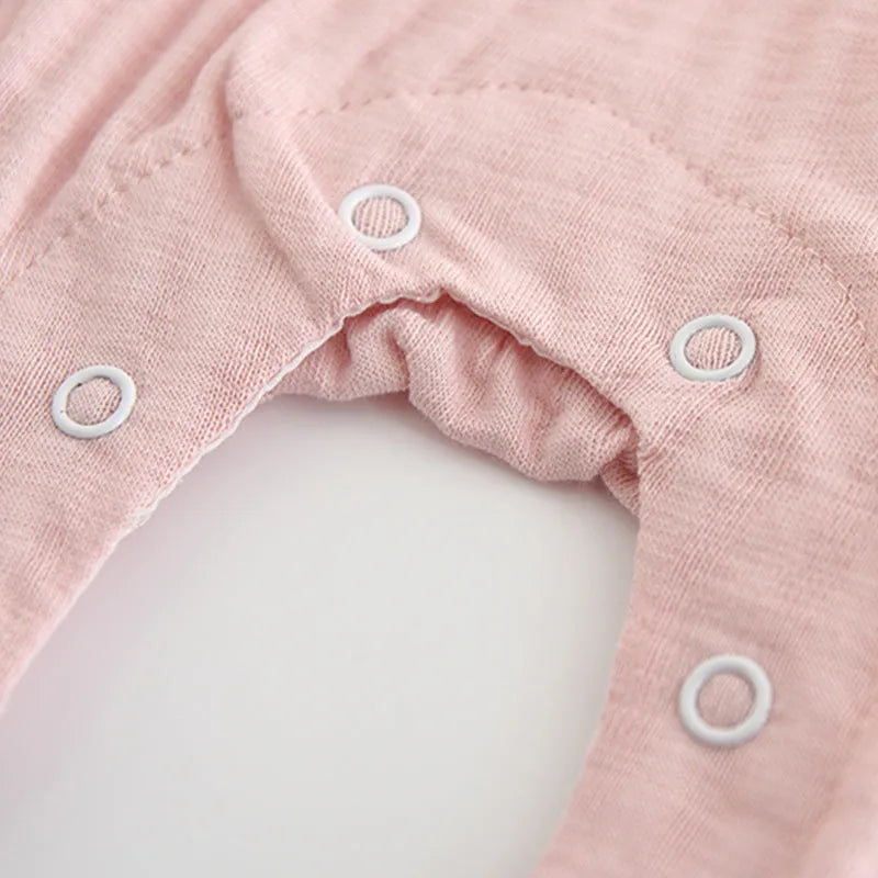 Pink cotton baby jumpsuit with embroidery and long sleeves for girls
