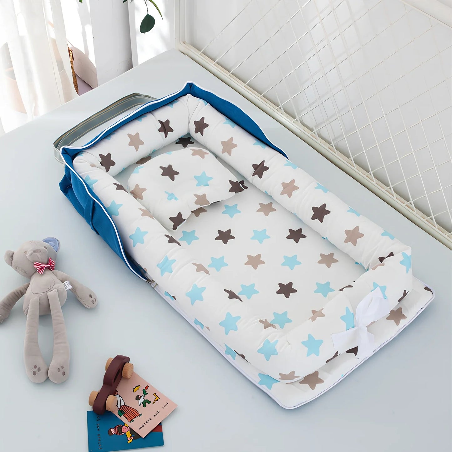 Foldable cotton portable baby crib in Animal World Blue, 90x50 cm with pillow and strap, weighing 1.3 kg
