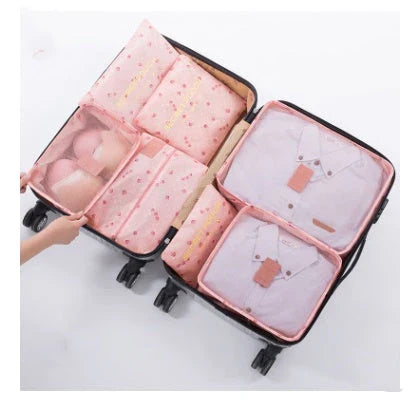 Durable waterproof packing cubes in various colors for organized, efficient travel