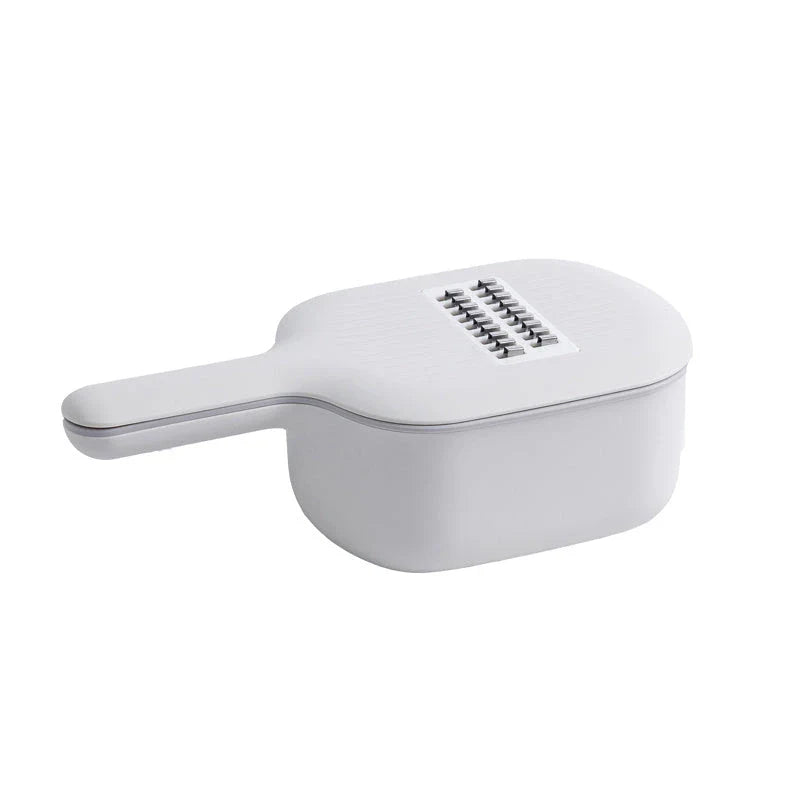 Multi-functional vegetable cutter with four blade designs for efficient kitchen tasks