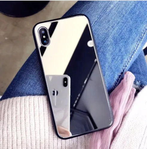 Black iPhone mirror phone case with reflective back cover for iPhone X and other models.