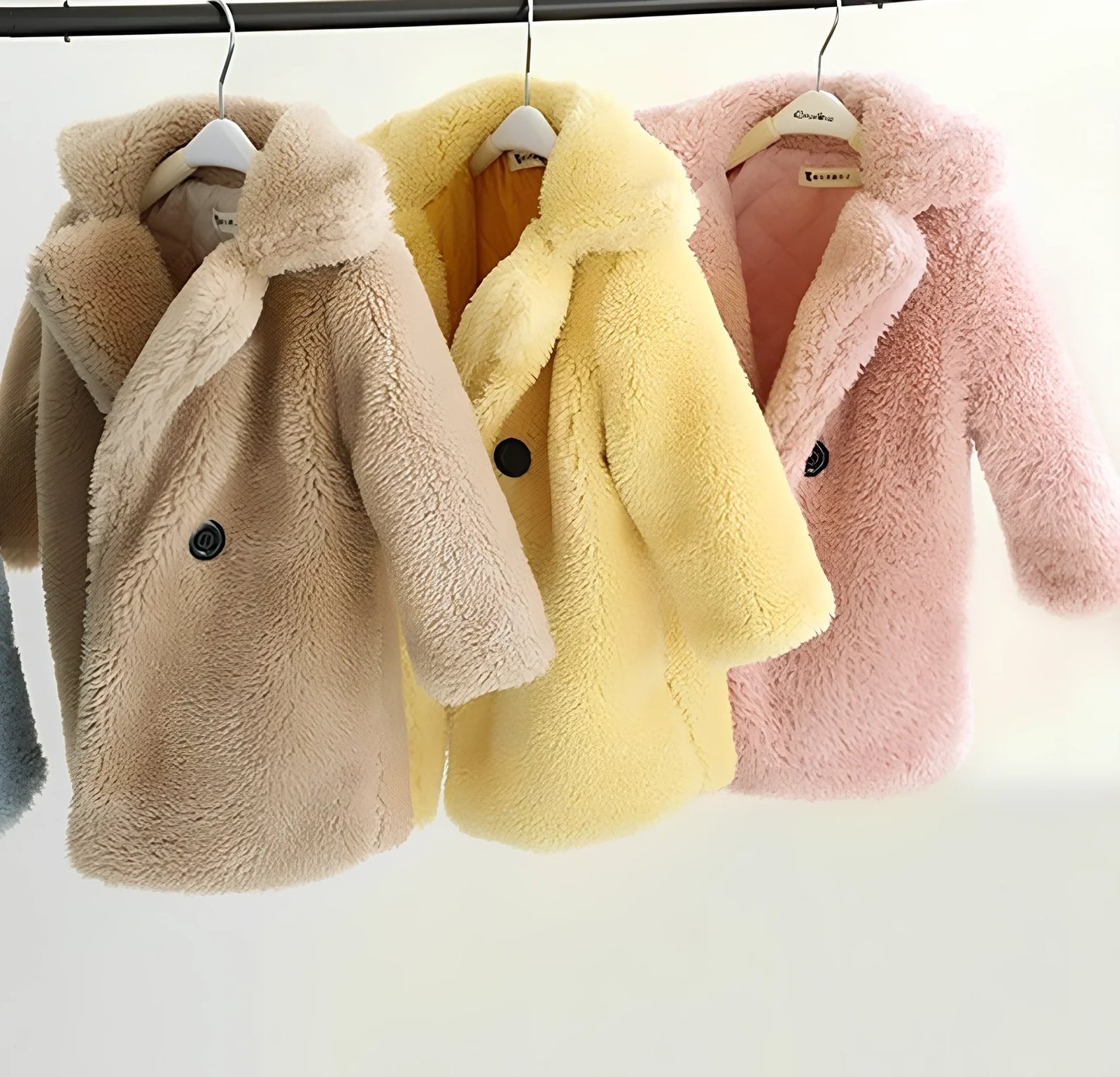 Children's cashmere fur coat in beige colour with suit collar and long sleeves for winter wear