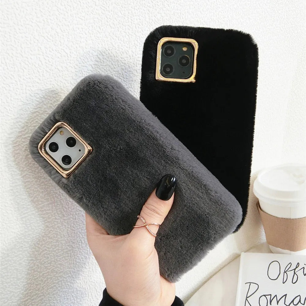A soft apricot-coloured silicone rabbit plush phone case for an iPhone, showing the raised camera circle and side buttons.