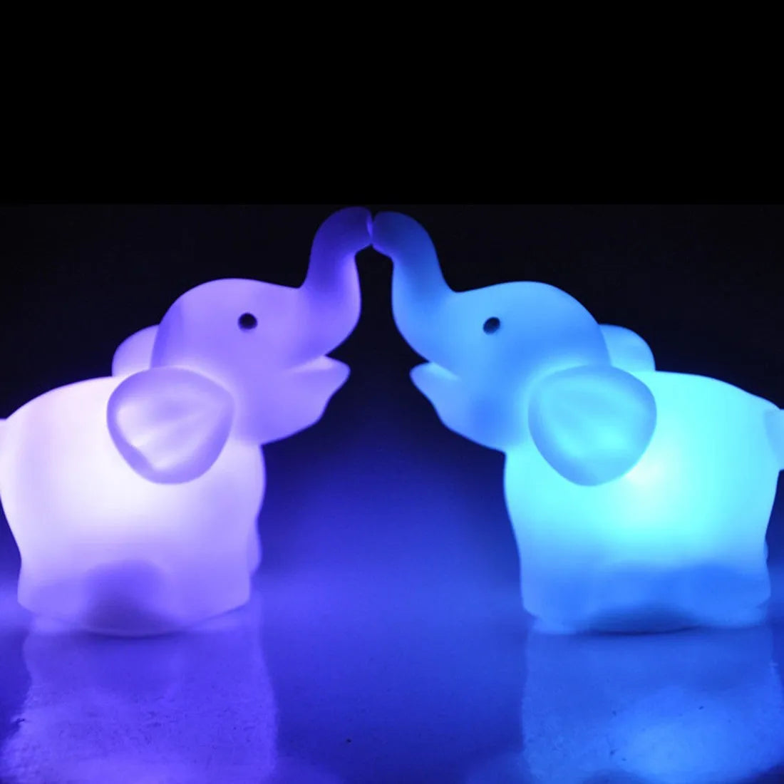 Elephant night light with 7 colour changing slow flashing modes, vinyl body, size 8x8.8x4.5cm, battery powered