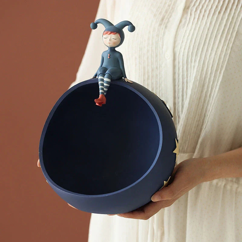 Hand-painted resin elf girl sculpture ornament with vibrant orange detailing