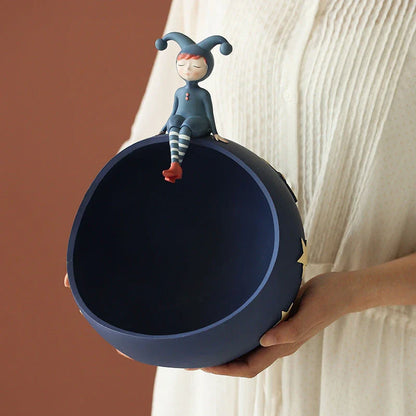 Hand-painted resin elf girl sculpture ornament with vibrant orange detailing