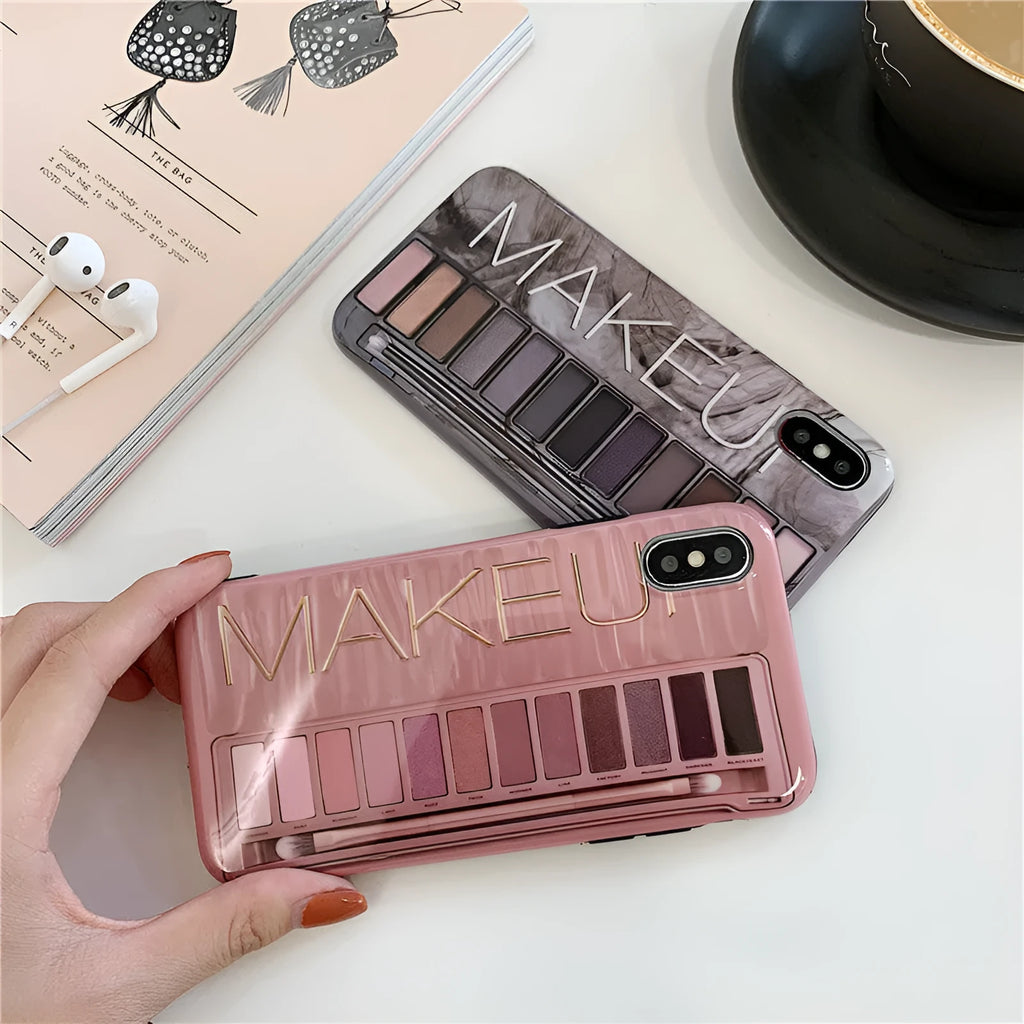 Flesh and grey silicone phone case for various iPhone models on a table.
