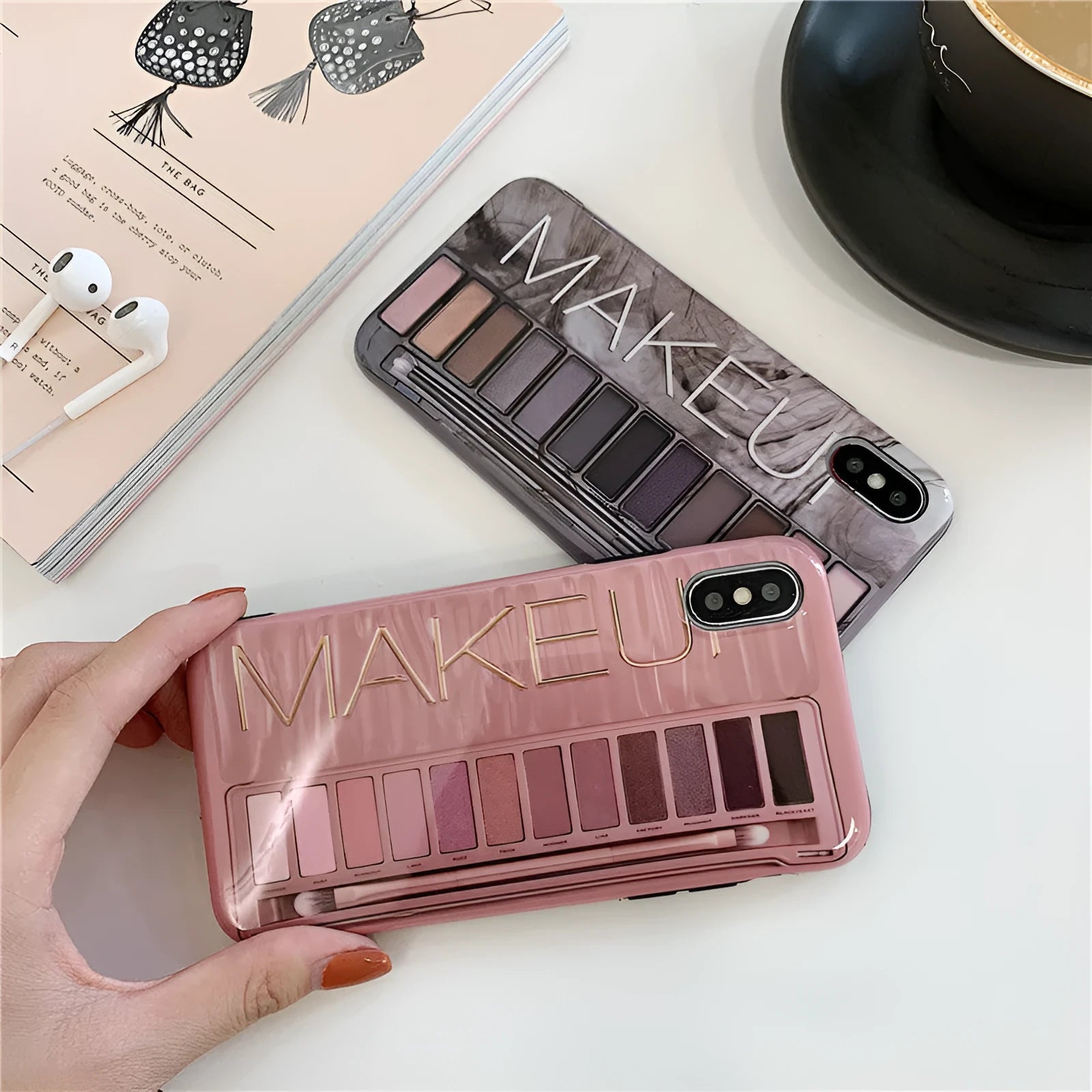 Flesh and grey silicone phone case for various iPhone models on a table.