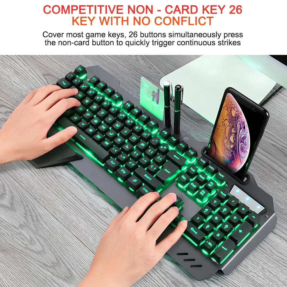 Black wired gaming keyboard with RGB backlight, phone holder, and magnetic wrist rest on desk