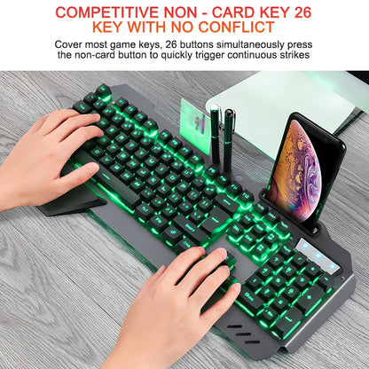 Black wired gaming keyboard with RGB backlight, phone holder, and magnetic wrist rest on desk