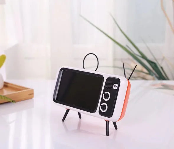 Retro TV mini portable Bluetooth speaker in blue with circular grille and compact 18x8x2.5cm size on a wooden desk