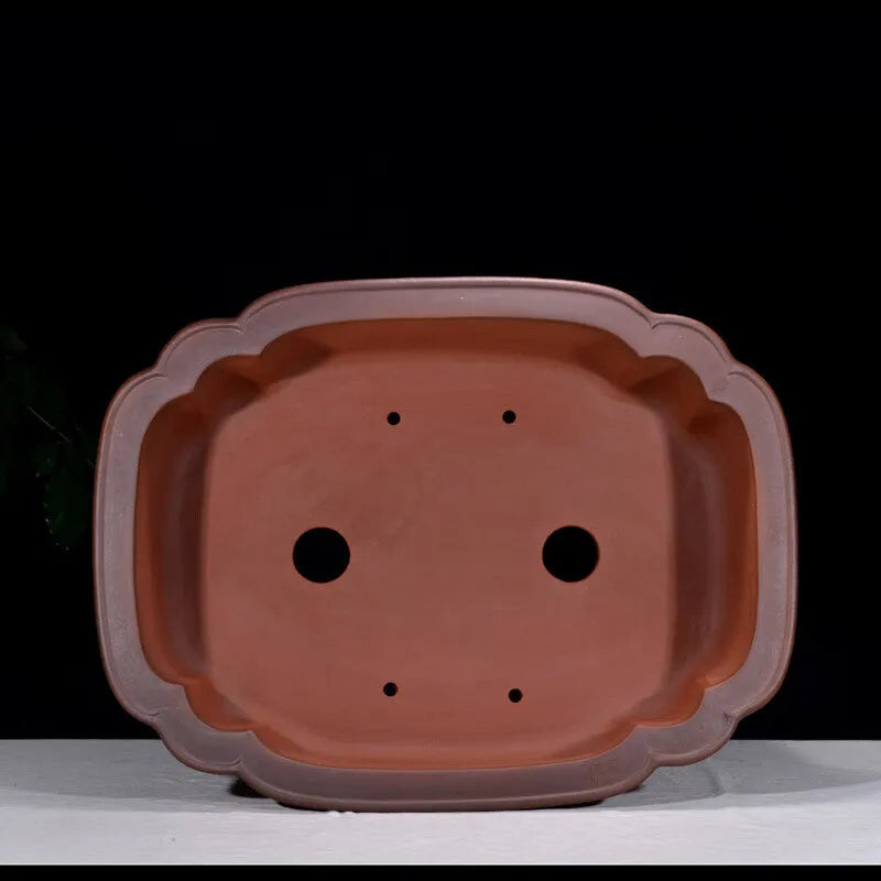 Large antique finish purple clay flowerpot with carved tree stump design featuring pine, cypress, pomegranate, golden marble and crabapple motifs