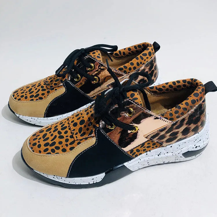 Women's suede sneakers with a wedge heel in various colours on a white background.