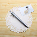 A multifunction orange ballpoint pen with a built-in silver slide vernier caliper, 15cm long.