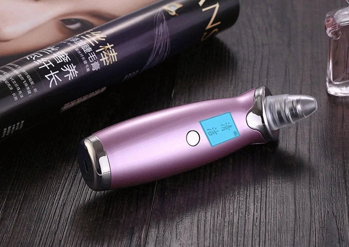 Blackhead vacuum cleaner with digital display showing 53KPa suction power and rose gold finish