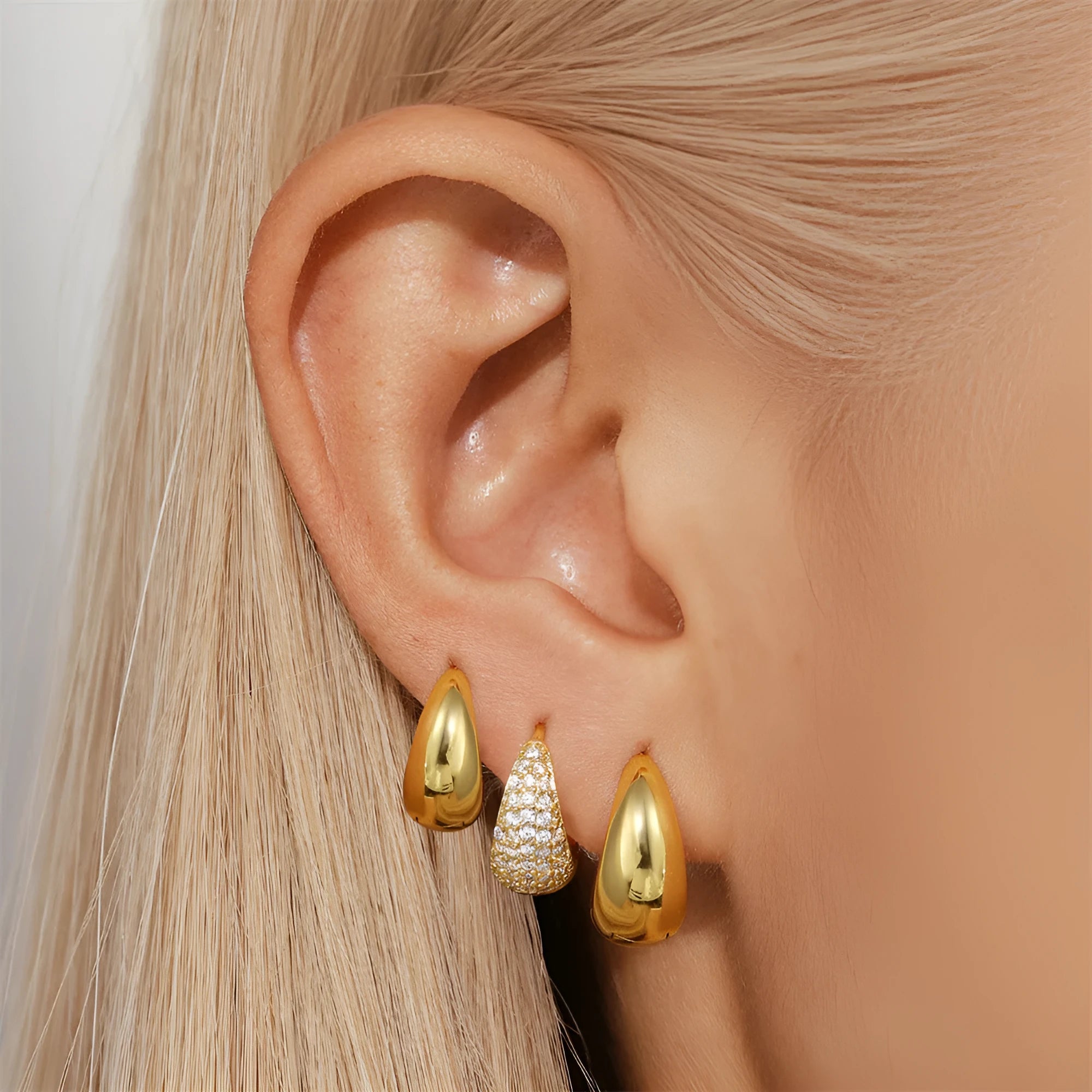 Geometric brass diamond earclip earrings with round elements in golden electroplated finish