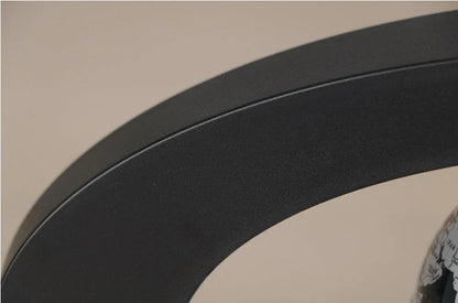 Magnetic levitation globe floating above base with LED light on